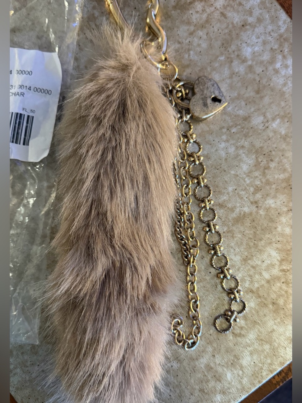 FREE PEOPLE Fluffy Tail Bag Charm BNWT
Tan,Called (Neutral on the shipping bag)